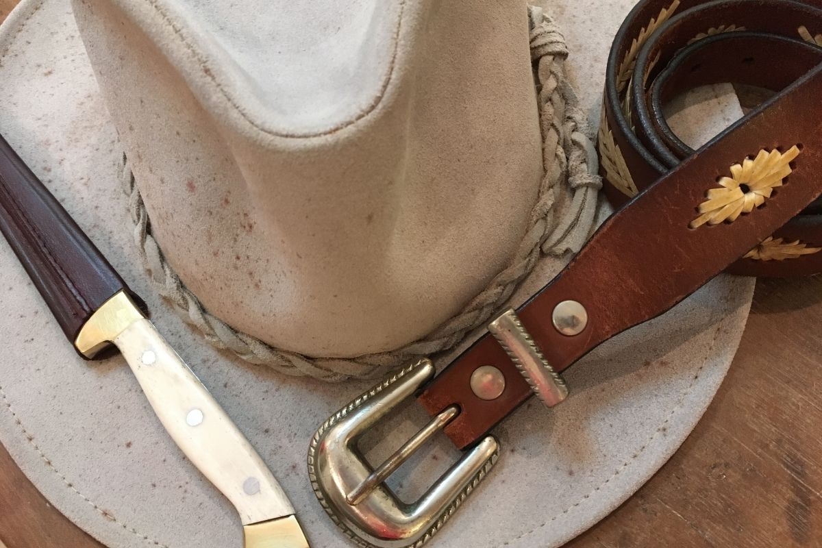 a western hat and belt