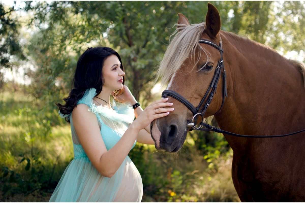 Pregnant woman with horse.